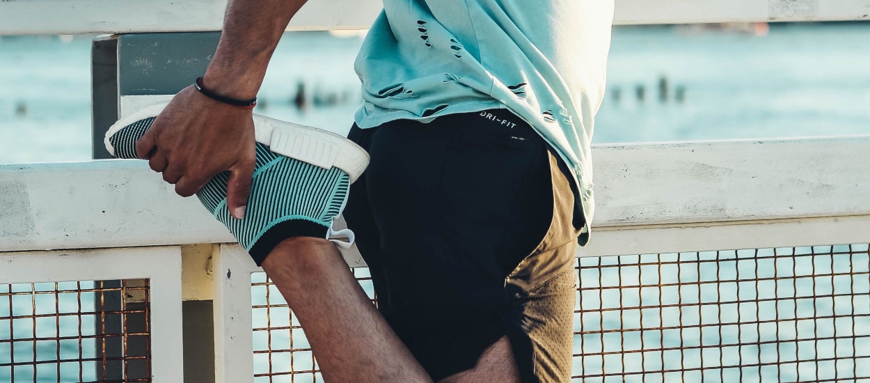 man-stretching-his-legs-before-jogging
