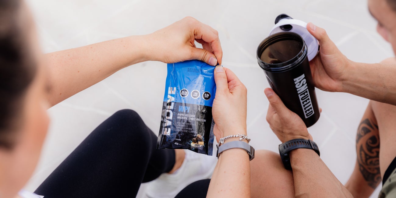 man-and-woman-making-protein-shake
