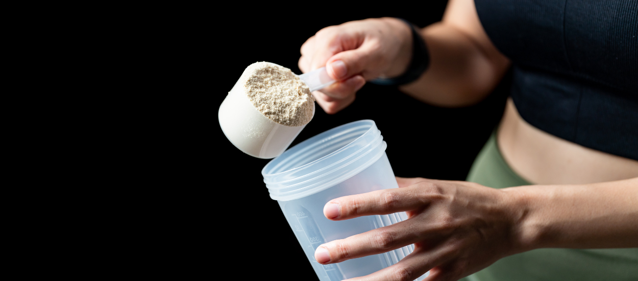 powder pouring into shaker with text pre-workout vs creatine